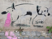 2140234-humorous-stencil-graffiti-of-a-peeing-dog-on-slovakian-wall